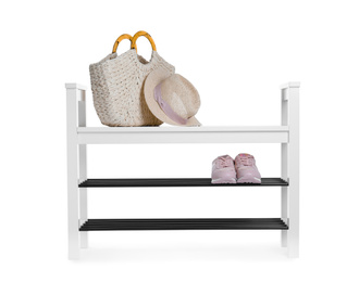 Photo of Stylish shoe shelf with sneakers, handbag and hat isolated on white
