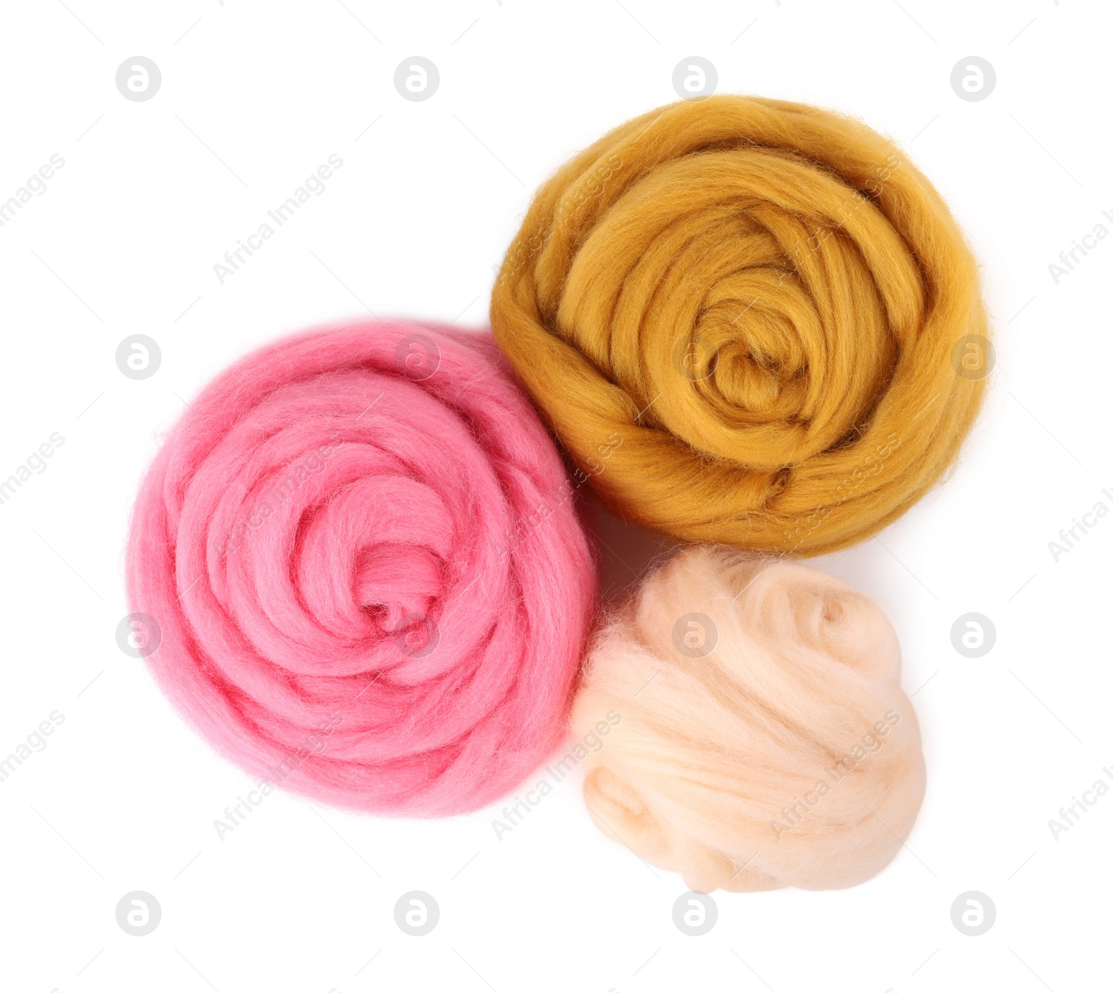 Photo of Beige, yellow and pink felting wool isolated on white, top view