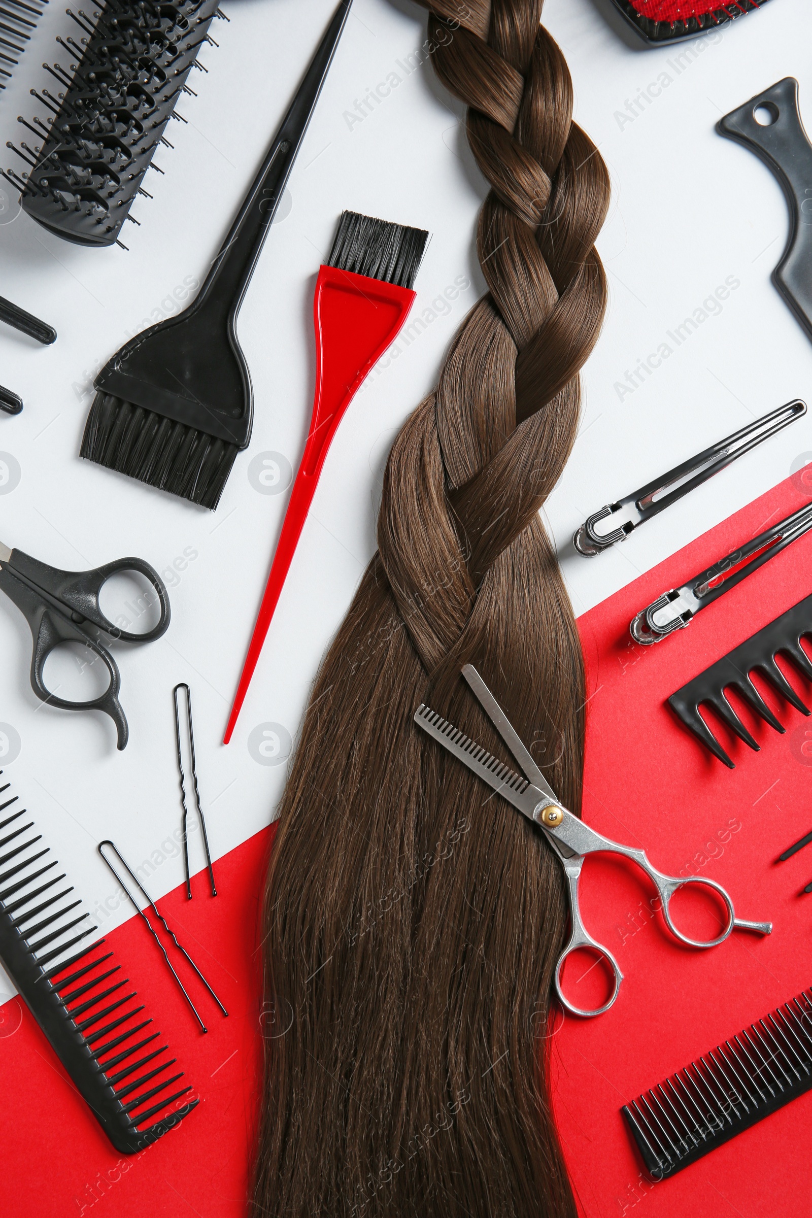 Photo of Flat lay composition with hair salon tools on color background