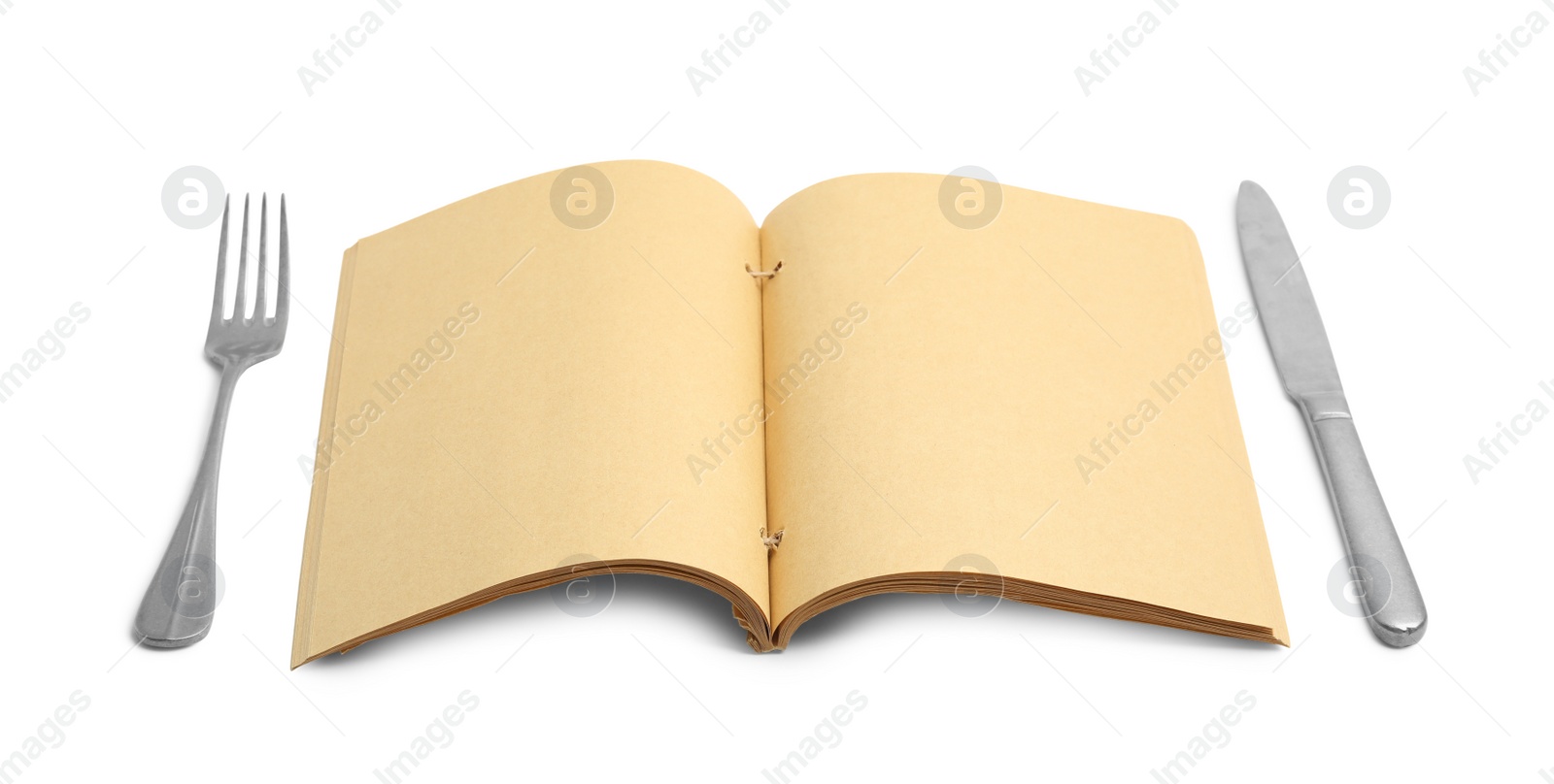 Photo of Blank recipe book and cutlery on white background. Space for text