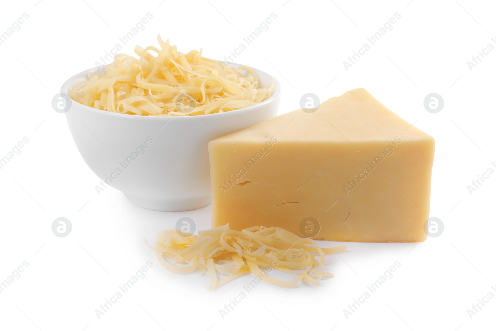 Photo of Grated and whole piece of cheese isolated on white