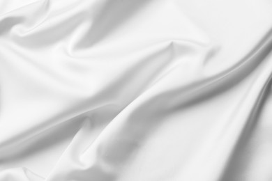 Photo of Texture of white silk ripple fabric as background, closeup