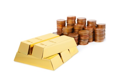 Shiny gold bars and coins on white background