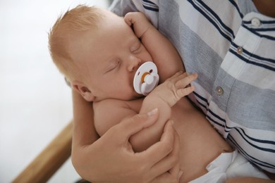 Mother with her newborn baby, closeup view