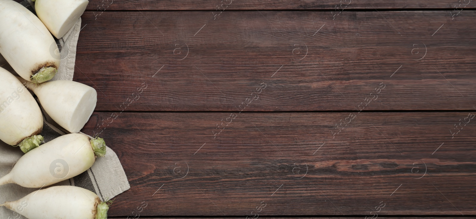 Image of White turnips on wooden table, flat lay. Space for text