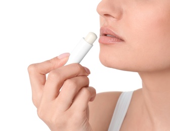 Photo of Woman applying hygienic lip balm, on white background