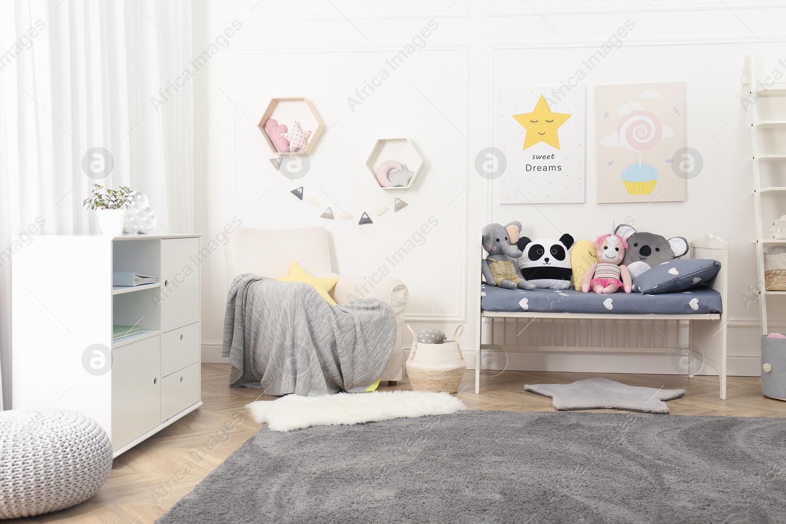 Photo of Child room interior with toys and stylish furniture