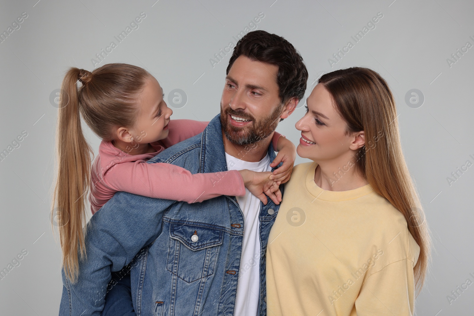 Photo of Portrait of happy family on light grey background