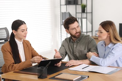 Couple having meeting with lawyer in office