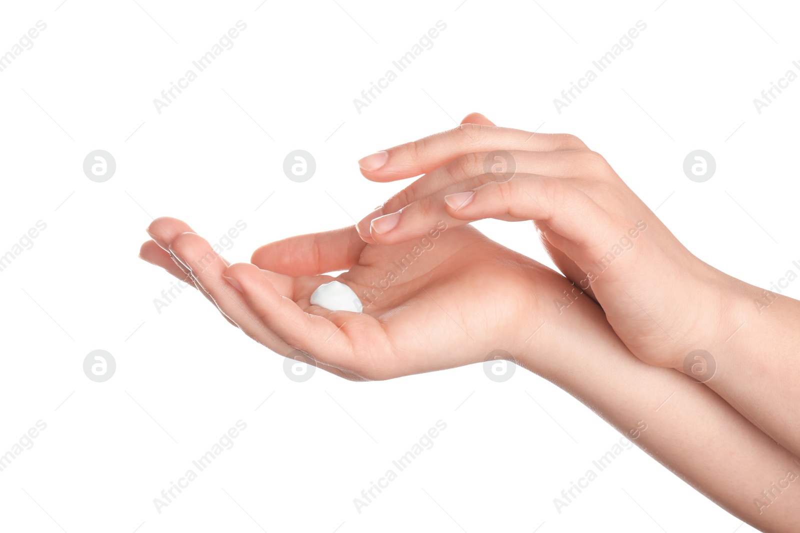 Photo of Woman applying cream onto hands isolated on white, closeup