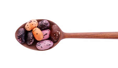 Photo of Wooden spoon with dry kidney beans isolated on white, top view