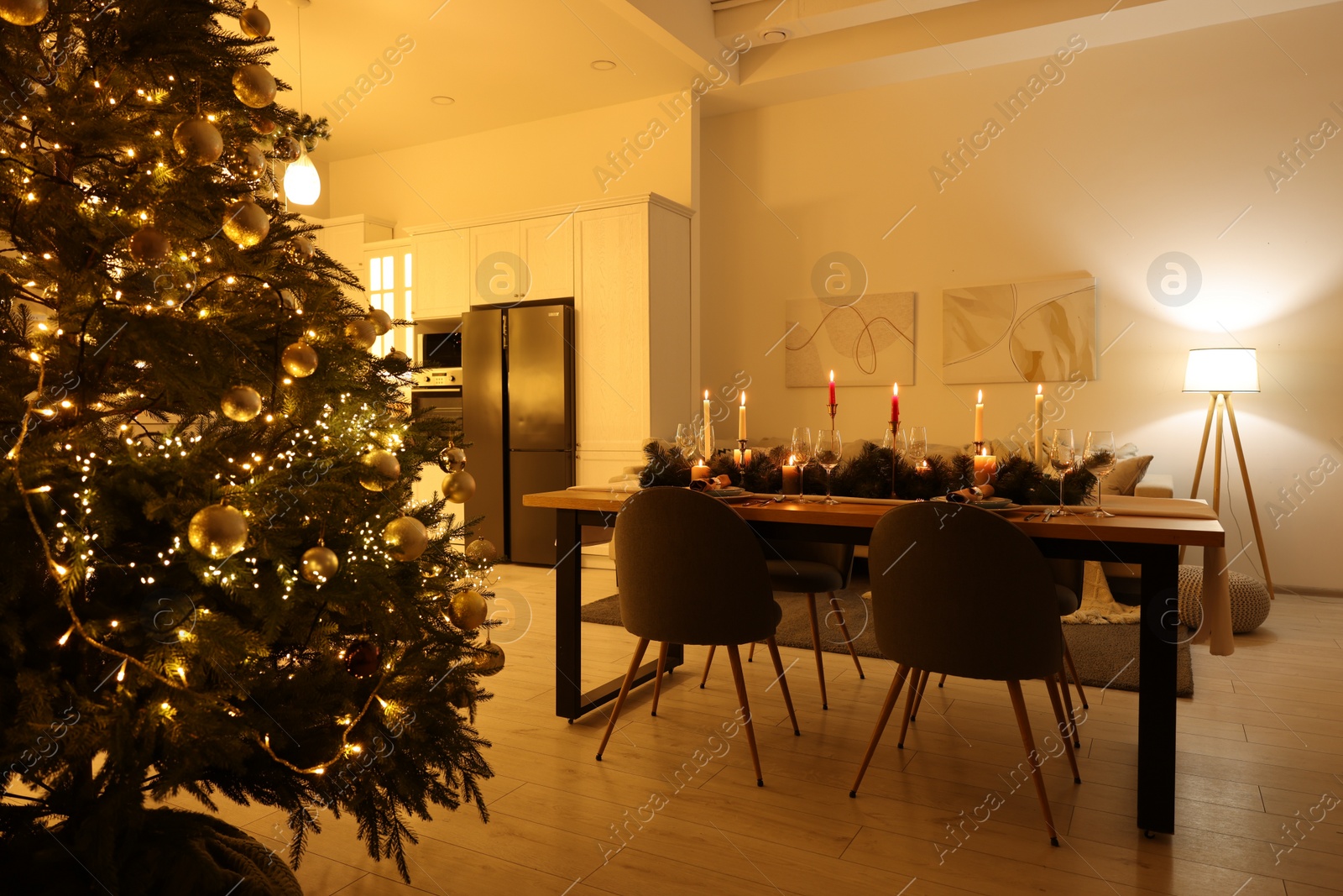 Photo of Cozy spacious kitchen decorated for Christmas. Interior design