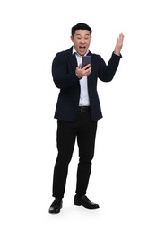 Photo of Shocked businessman in suit with smartphone on white background