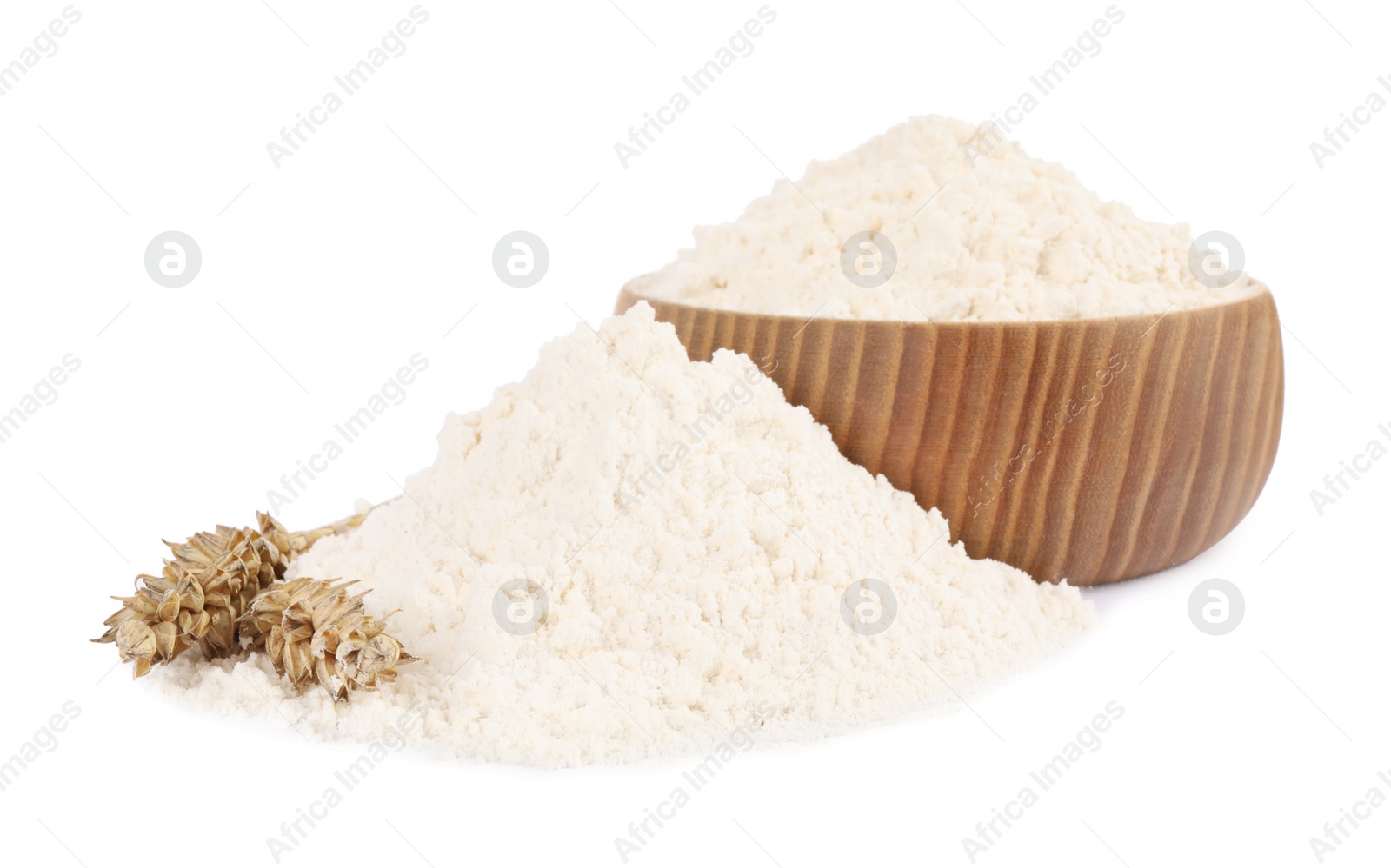 Photo of Wooden bowl with wheat flour on white background