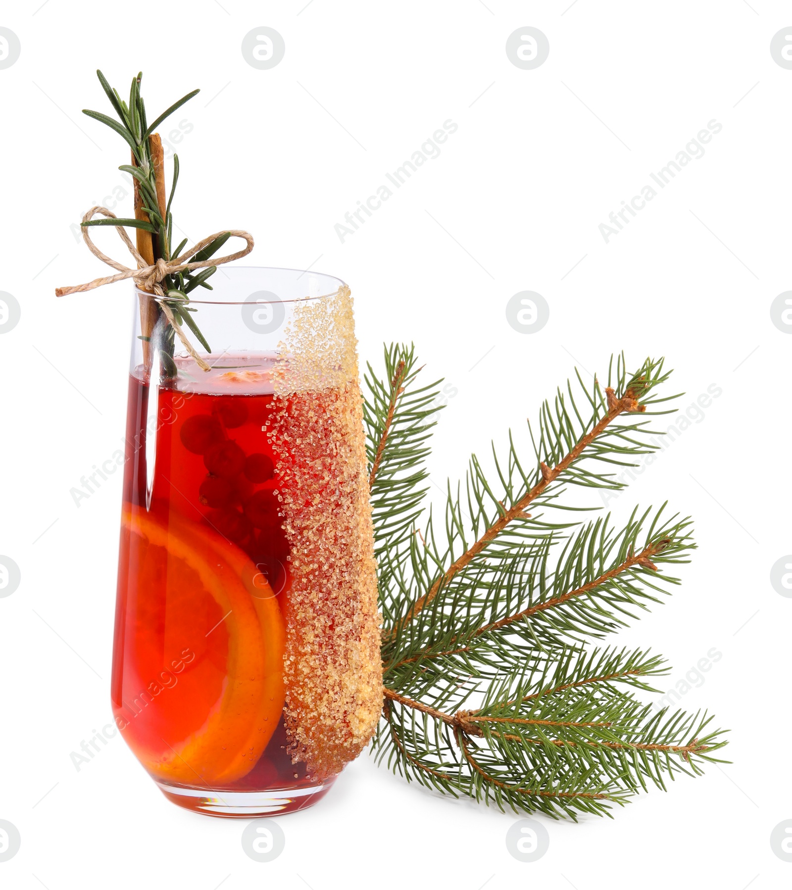 Photo of Christmas Sangria cocktail in glass and fir tree branch isolated on white