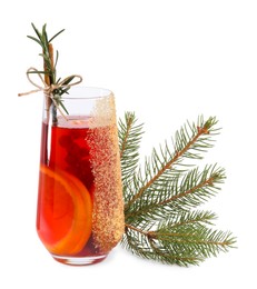 Photo of Christmas Sangria cocktail in glass and fir tree branch isolated on white