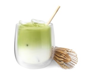 Photo of Glass of tasty iced matcha latte and bamboo whisk isolated on white