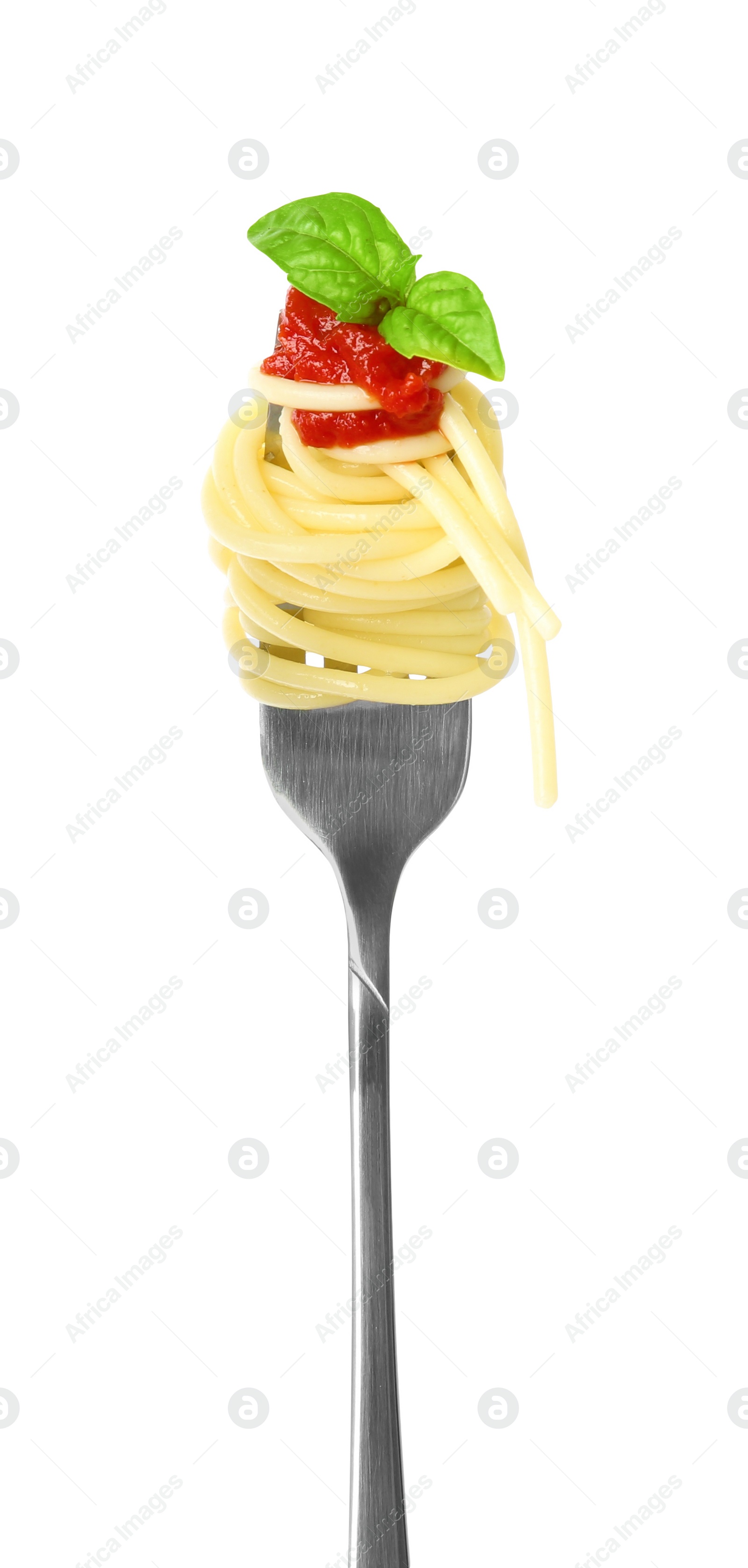 Photo of Fork with tasty pasta, tomato sauce and basil isolated on white