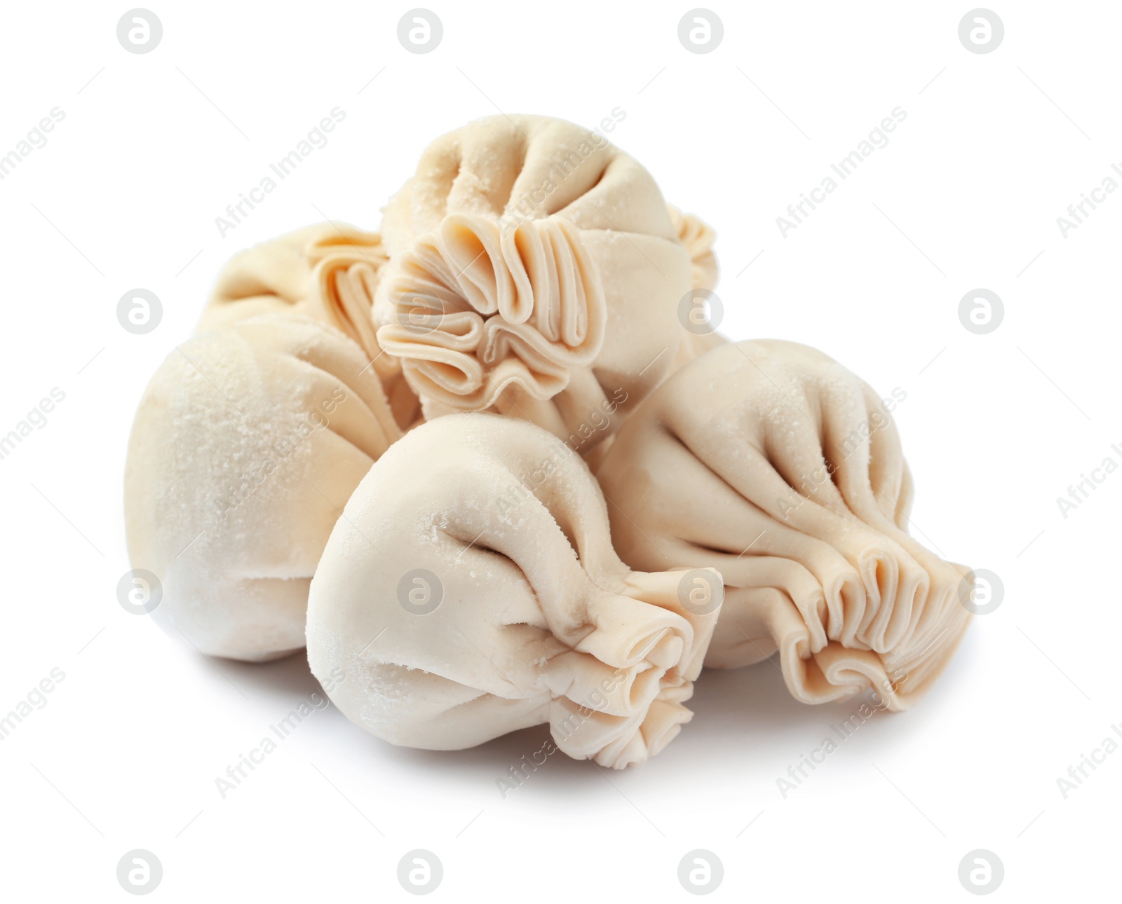 Photo of Pile of raw dumplings on white background