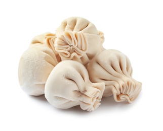 Photo of Pile of raw dumplings on white background