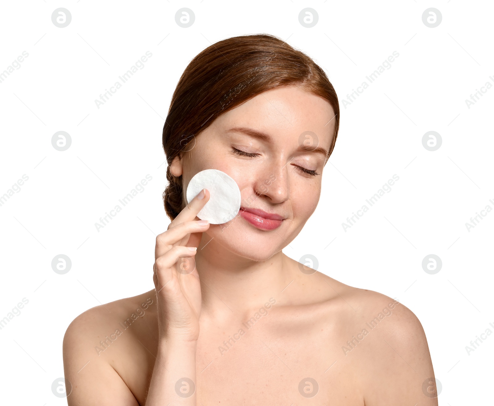 Photo of Beautiful woman with freckles holding cotton pad on white background