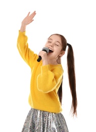 Photo of Little girl singing into microphone on white background