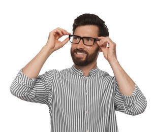 Portrait of smiling bearded man with glasses on white background