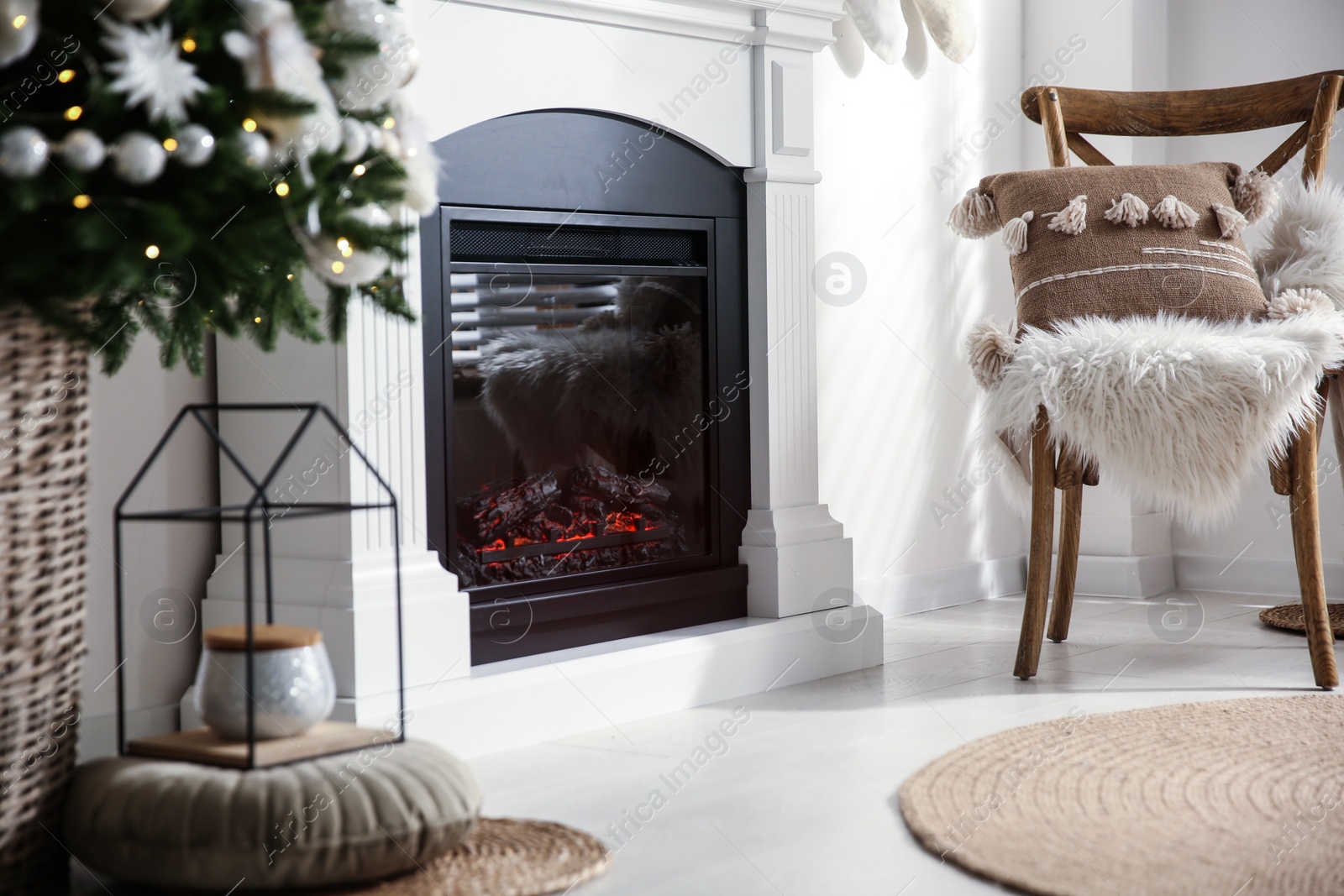 Photo of Modern fireplace in living room decorated for Christmas