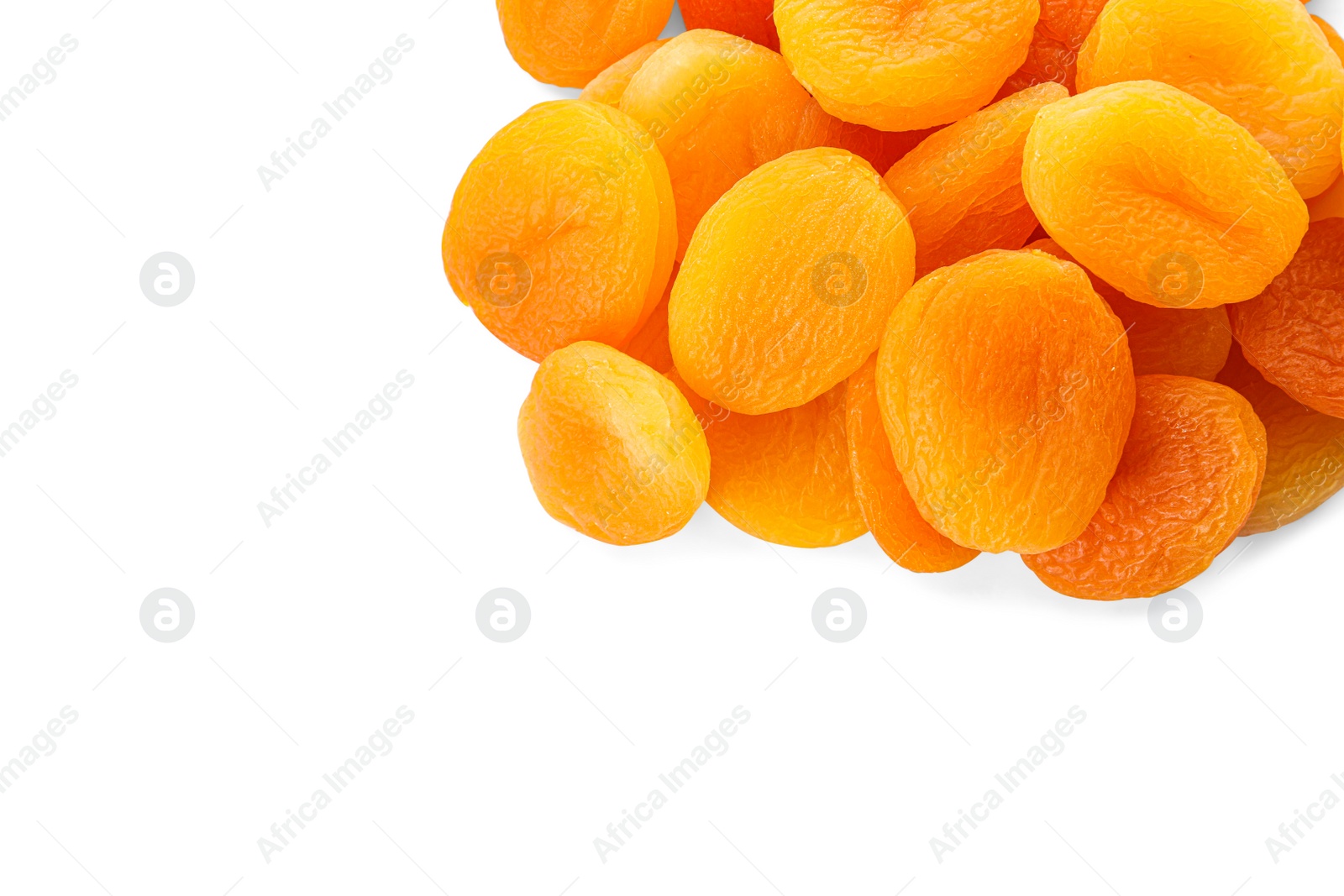 Photo of Pile of tasty apricots on white background, top view. Dried fruits