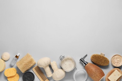 Photo of Bath accessories. Flat lay composition with personal care products on light grey background, space for text
