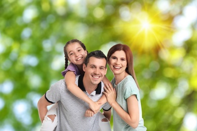 Image of Happy family with child outdoors on sunny day
