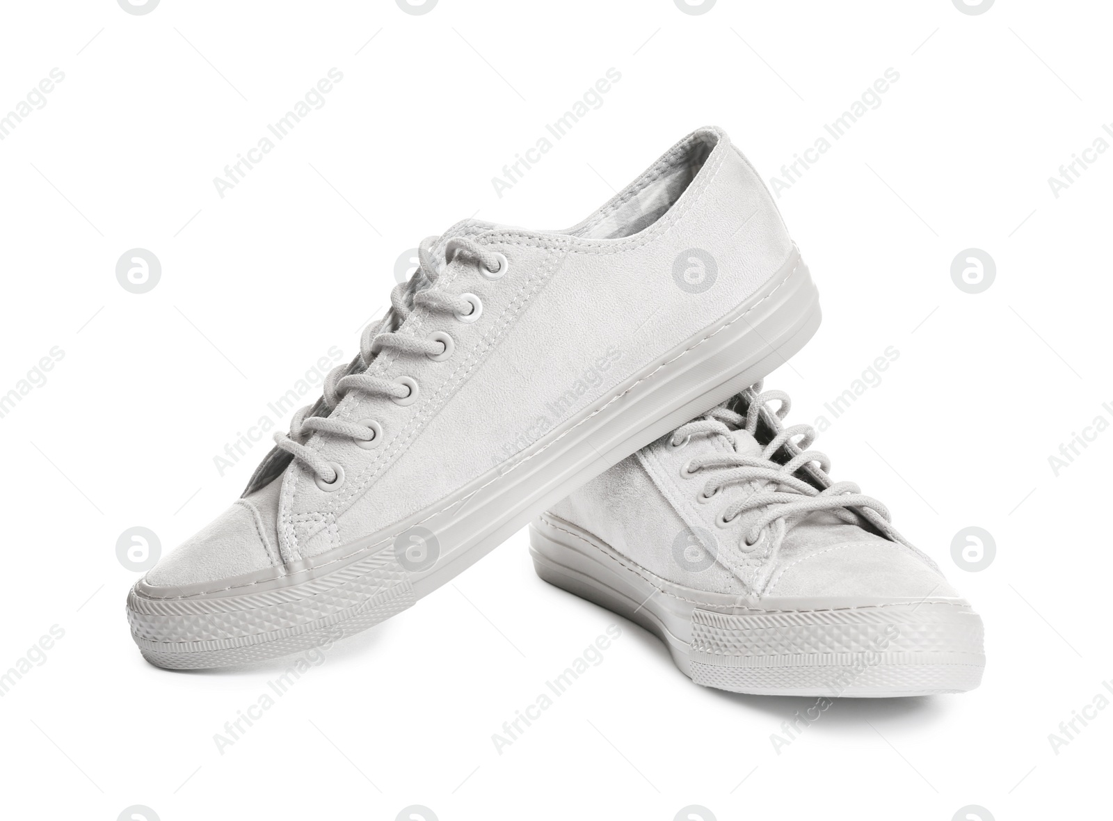 Photo of Pair of stylish sneakers on white background