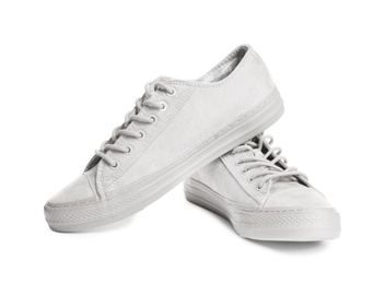 Pair of stylish sneakers on white background