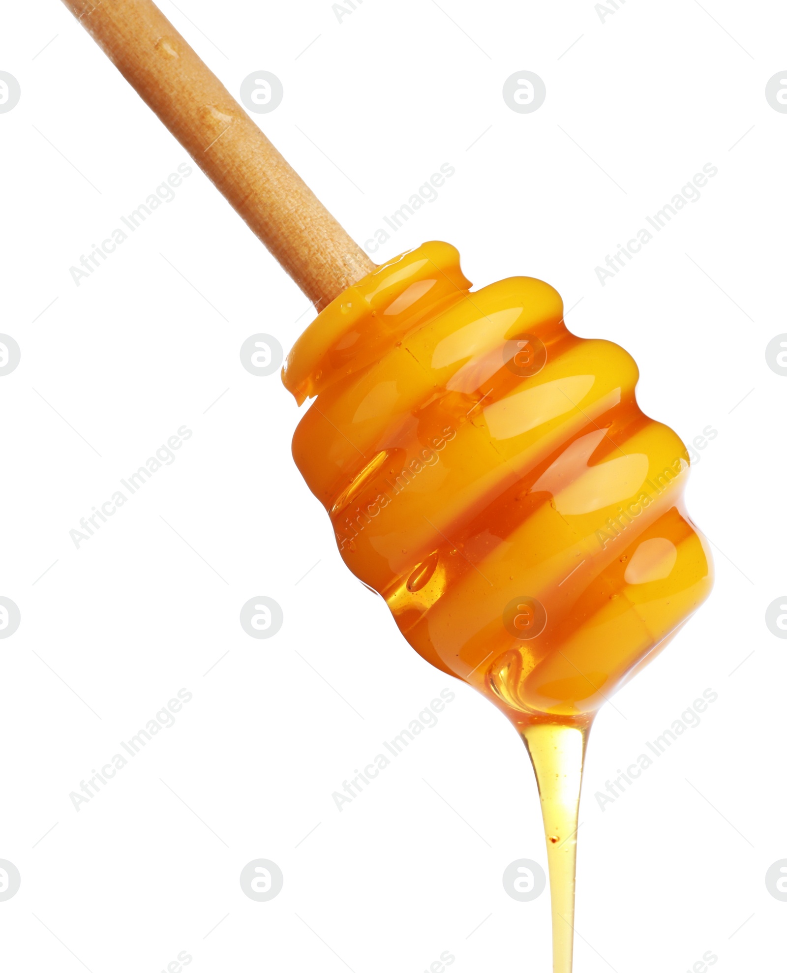 Photo of Honey dripping from dipper on white background