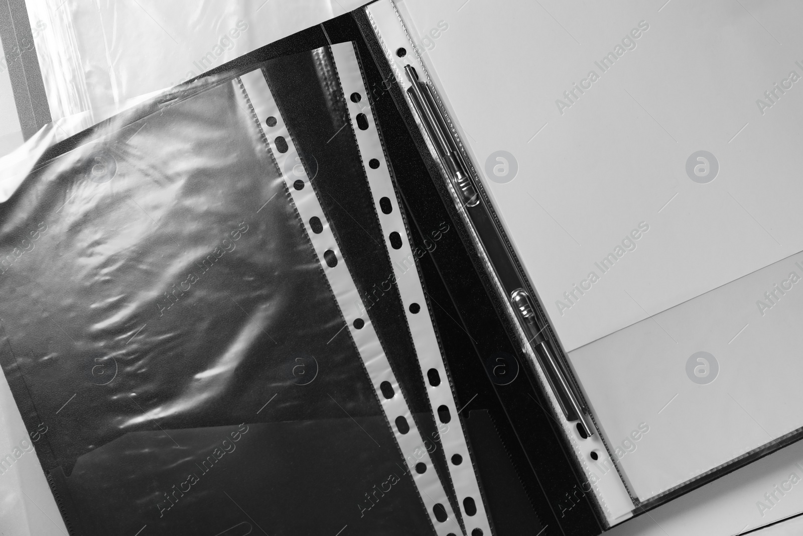 Photo of Folders with punched pockets on white table, flat lay