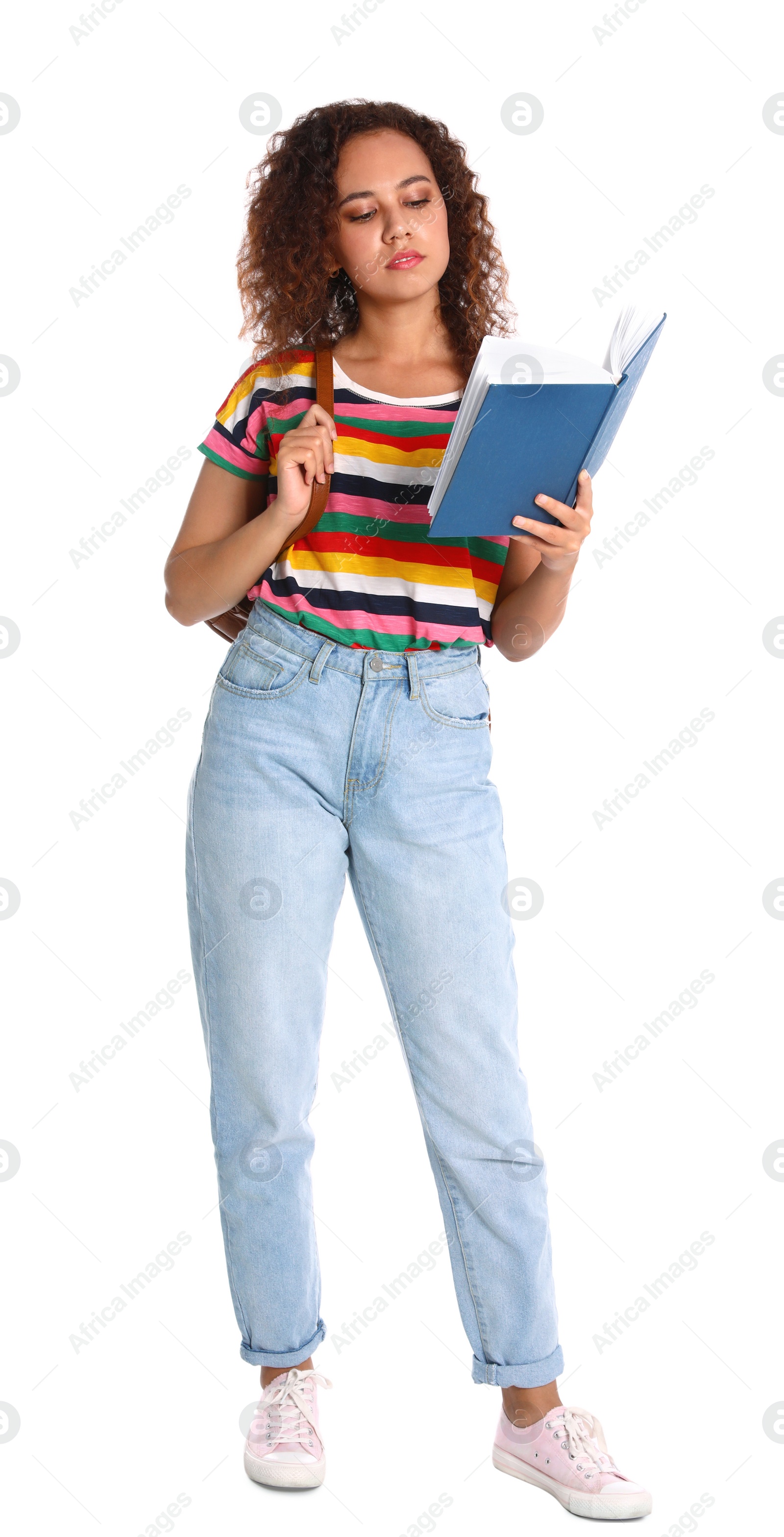 Photo of Beautiful African-American woman reading book on white background