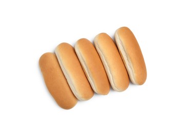 Tasty fresh buns for hot dogs on white background, top view