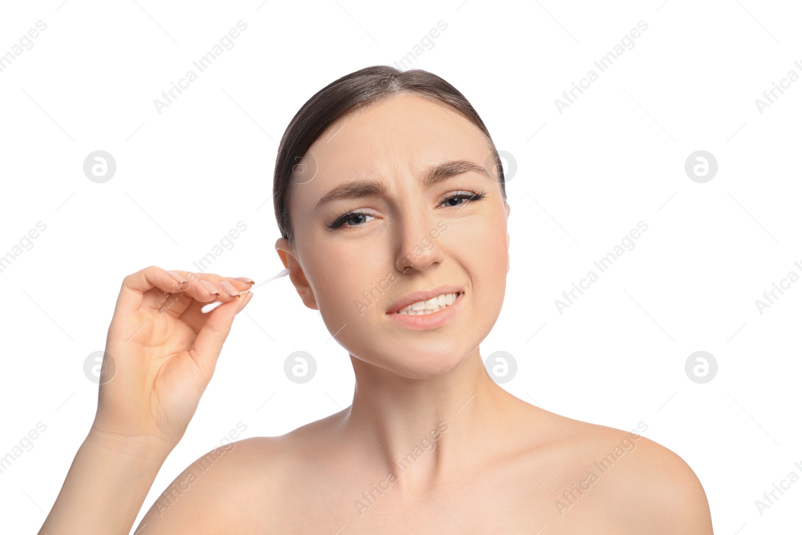 Photo of Young woman cleaning ear with cotton swab on white background