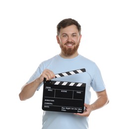 Photo of Making movie. Smiling man with clapperboard on white background