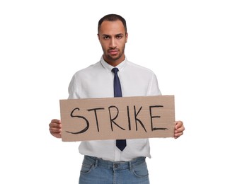 Photo of Upset man holding cardboard banner with word Strike on white background