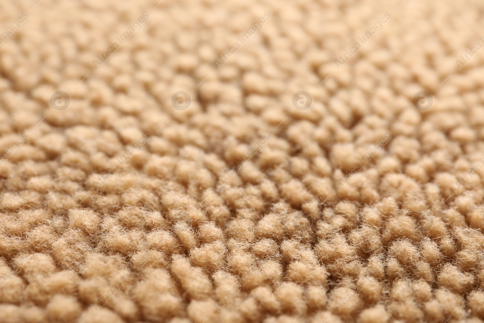 Photo of Texture of light brown faux fur as background, closeup