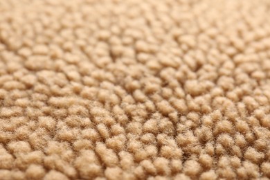 Photo of Texture of light brown faux fur as background, closeup