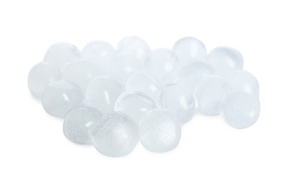 Photo of Many frozen ice balls on white background