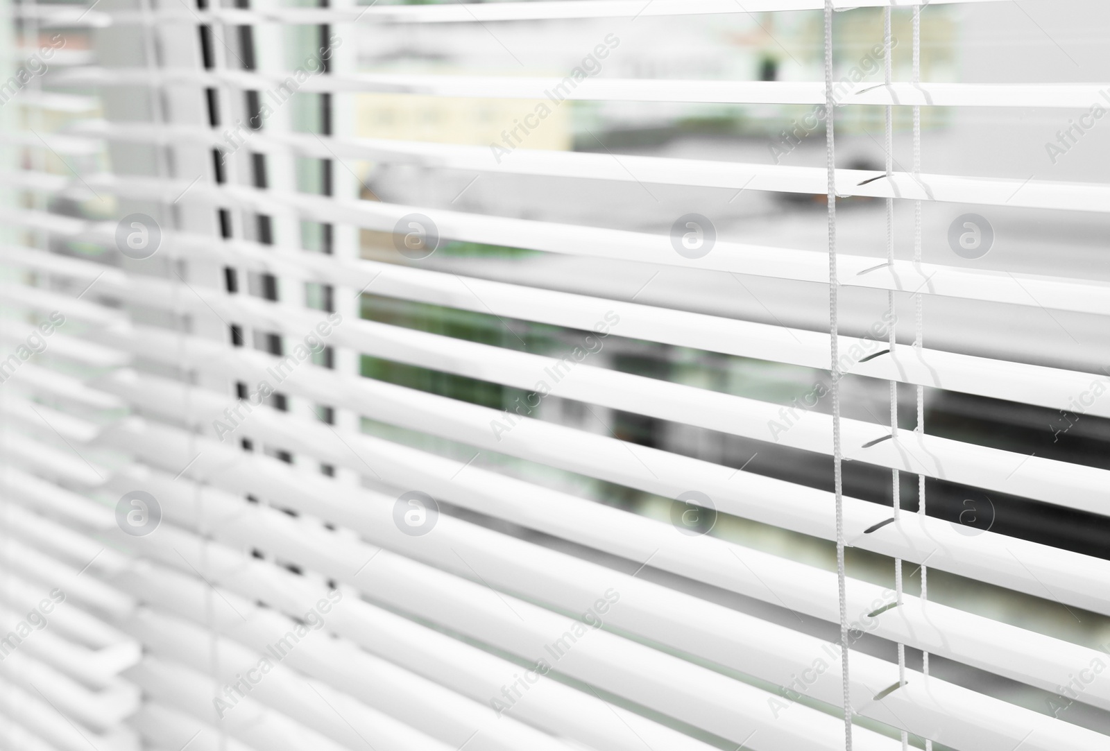 Photo of Closeup view of stylish horizontal window blinds