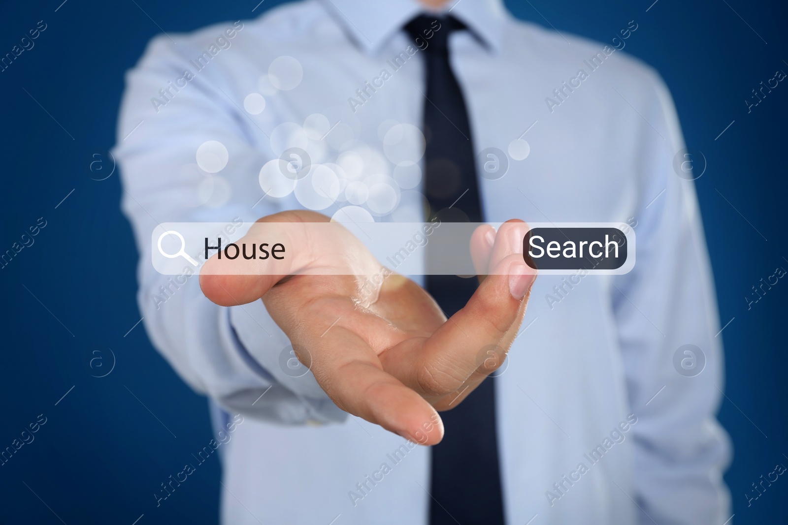Image of Real estate agent holding virtual search bar with word House on blue background, closeup