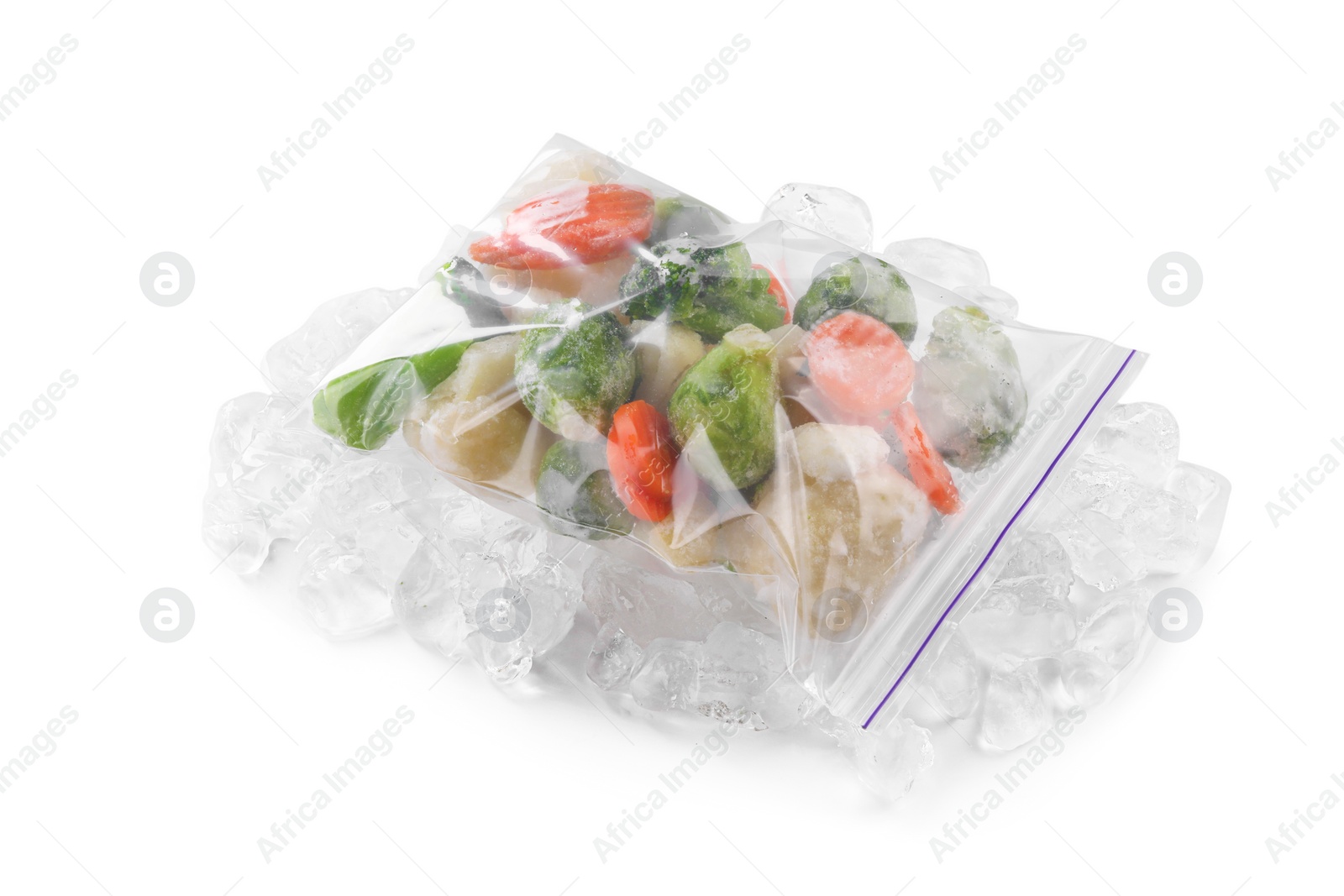 Photo of Mix of different frozen vegetables with ice isolated on white