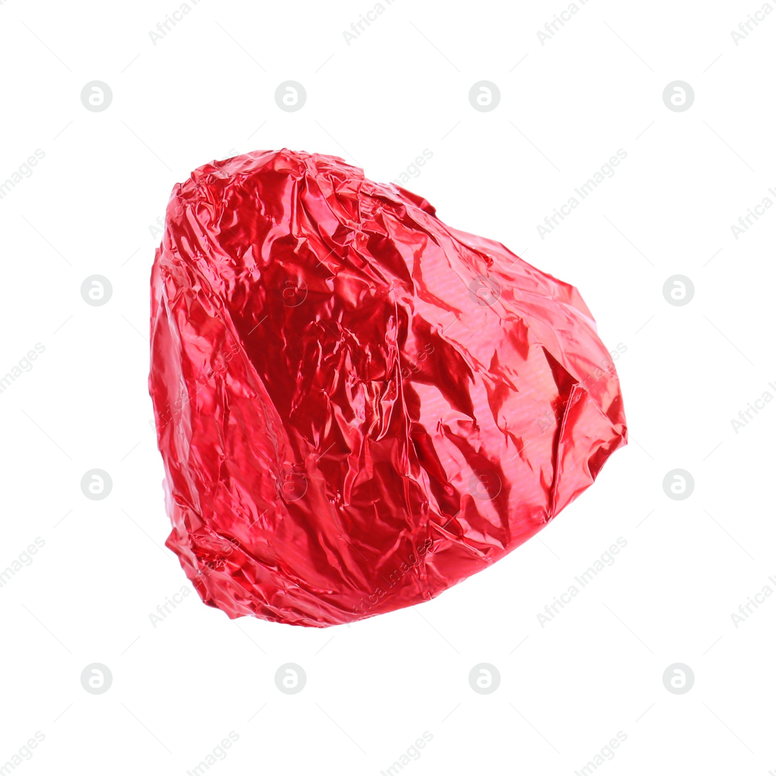 Photo of Tasty candy in red wrapper isolated on white
