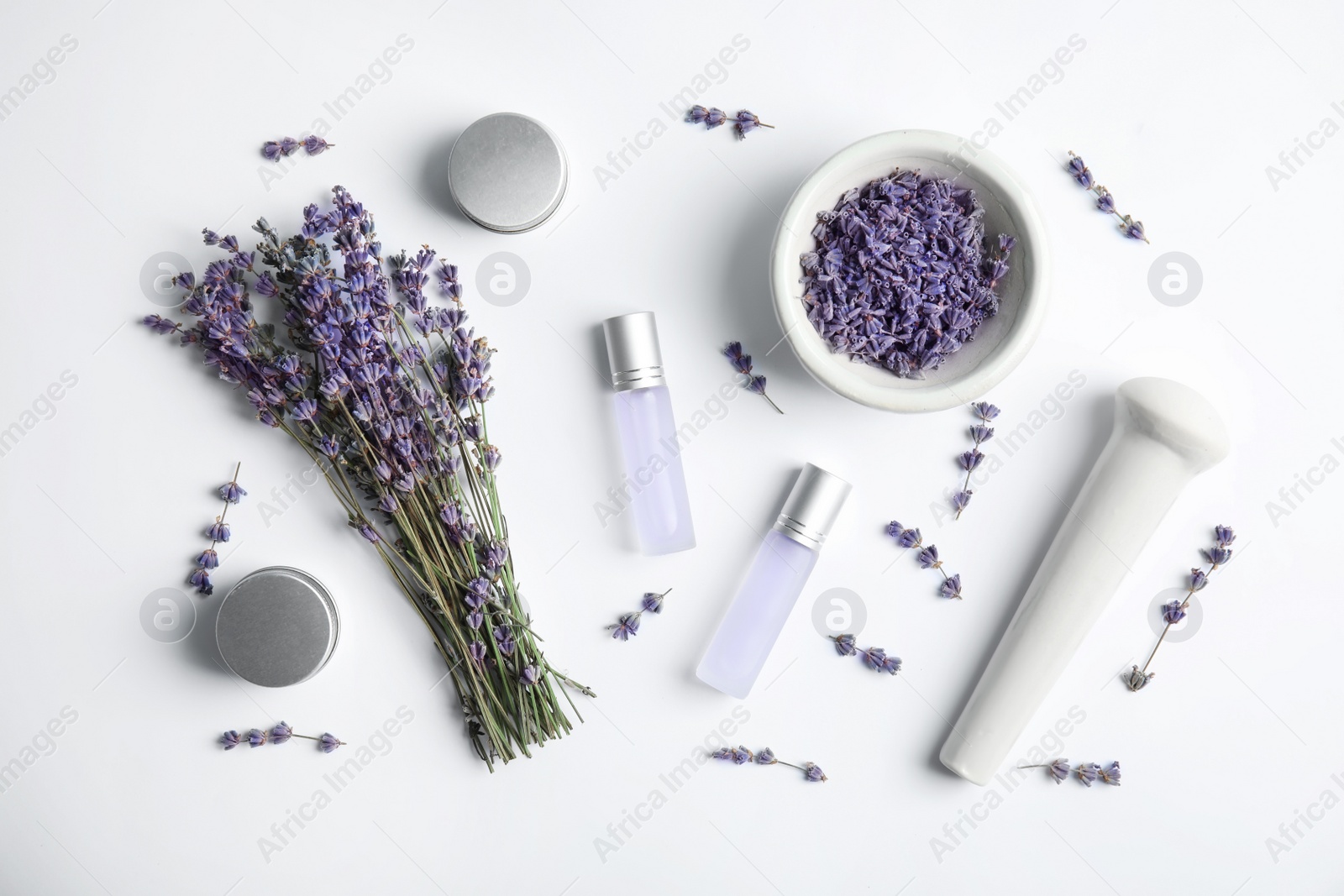 Photo of Composition with lavender flowers and natural cosmetic on white background, top view