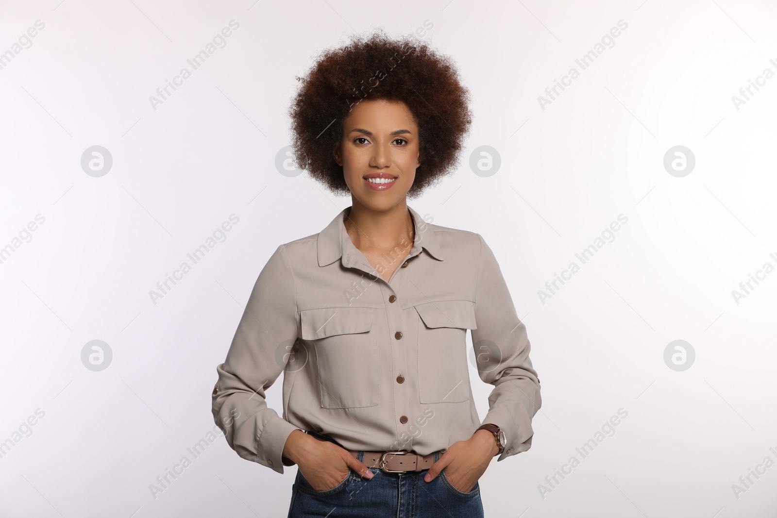 Photo of Portrait of beautiful young woman in stylish blouse on white background