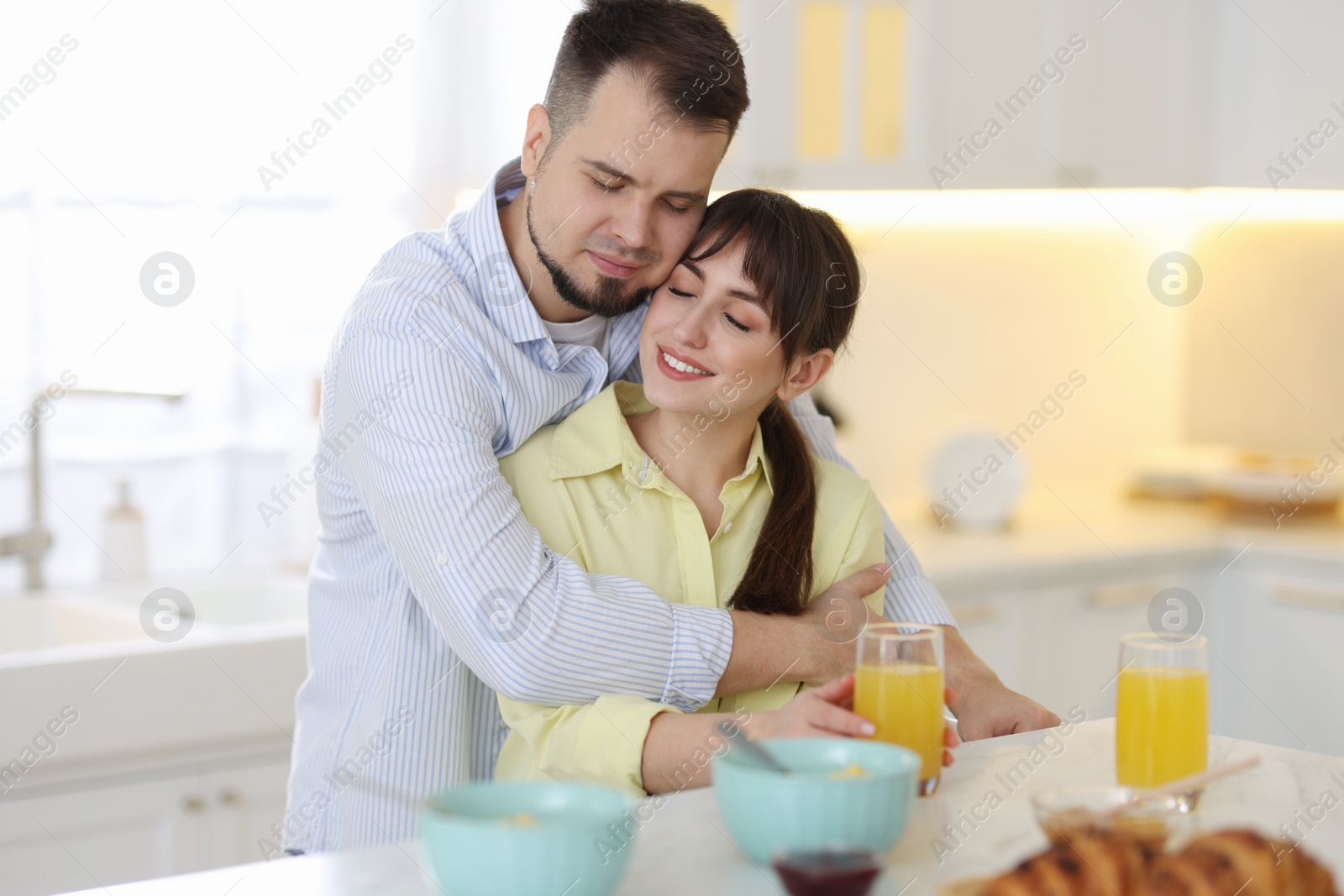 Photo of Lovely couple spending time together during breakfast at home